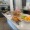 a table of fruit and breakfast items