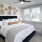 a bedroom with a bed and a fan