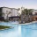a swimming pool in front of a building