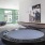 a room with a table, chairs and games